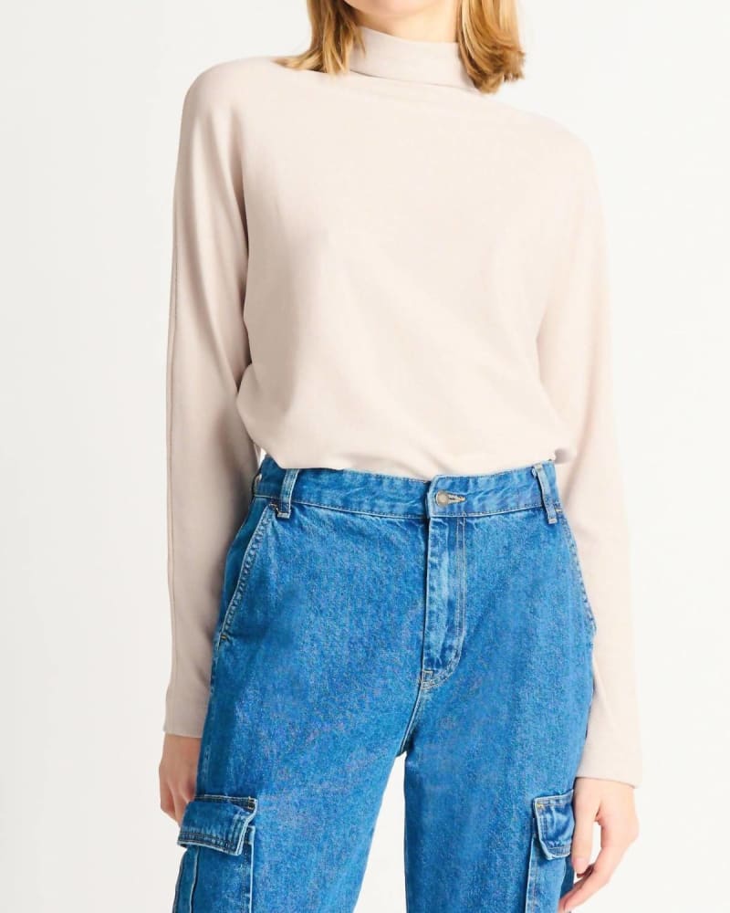 Front of a model wearing a size XL Ribbed Mockneck Knit Top in Sandstone in Sandstone by Dex. | dia_product_style_image_id:326756